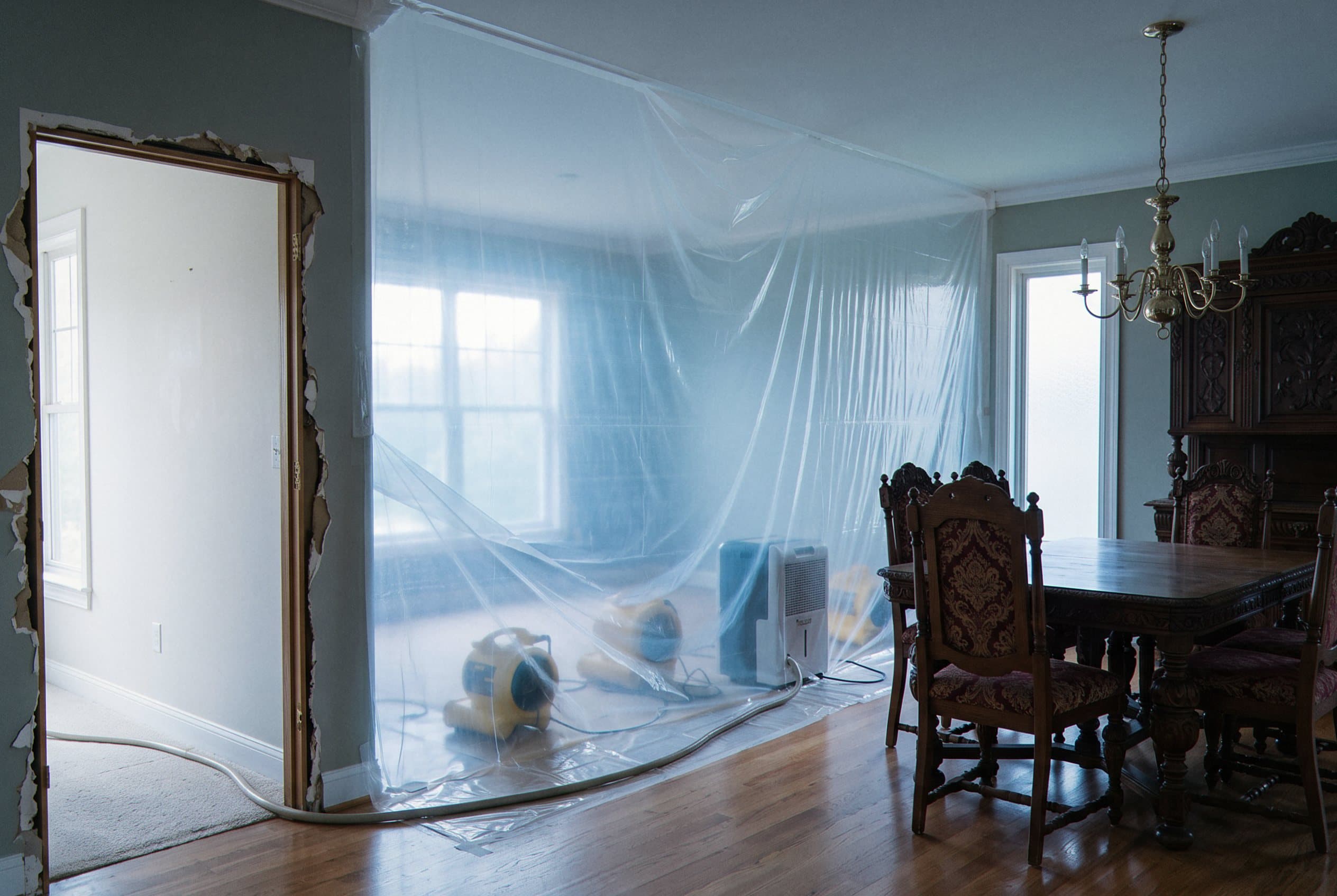 Industrial dehumidifier and air movers positioned for optimal airflow